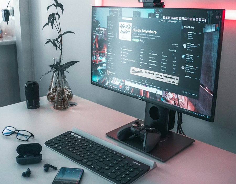 Computer desk with monitor, keyboard and accessories